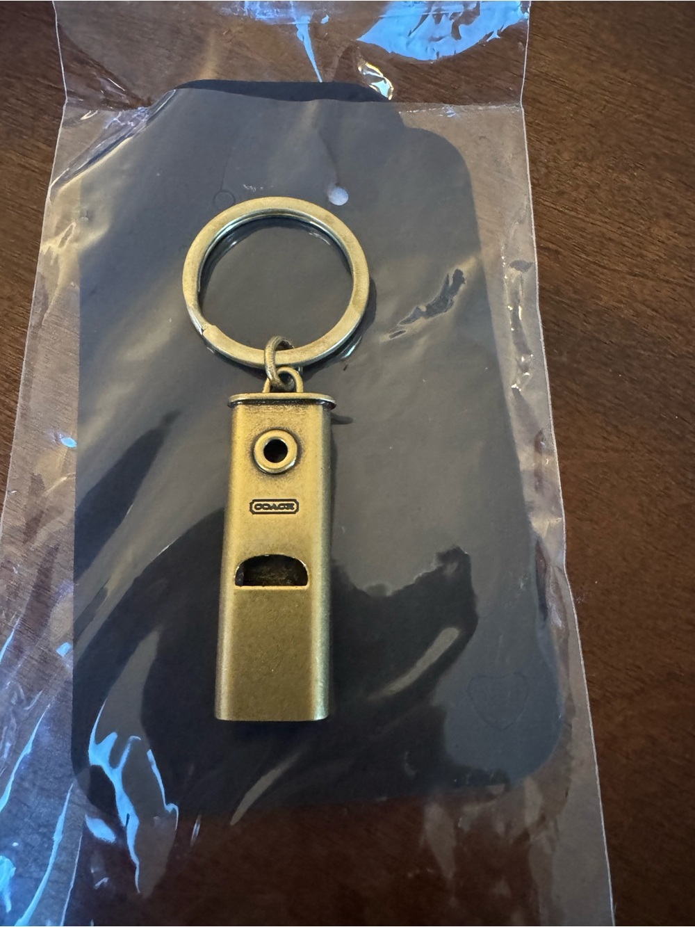 Coach vintage brass-finish metal whistle key ring